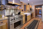 Fully equipped kitchen with gas range and wine fridge
